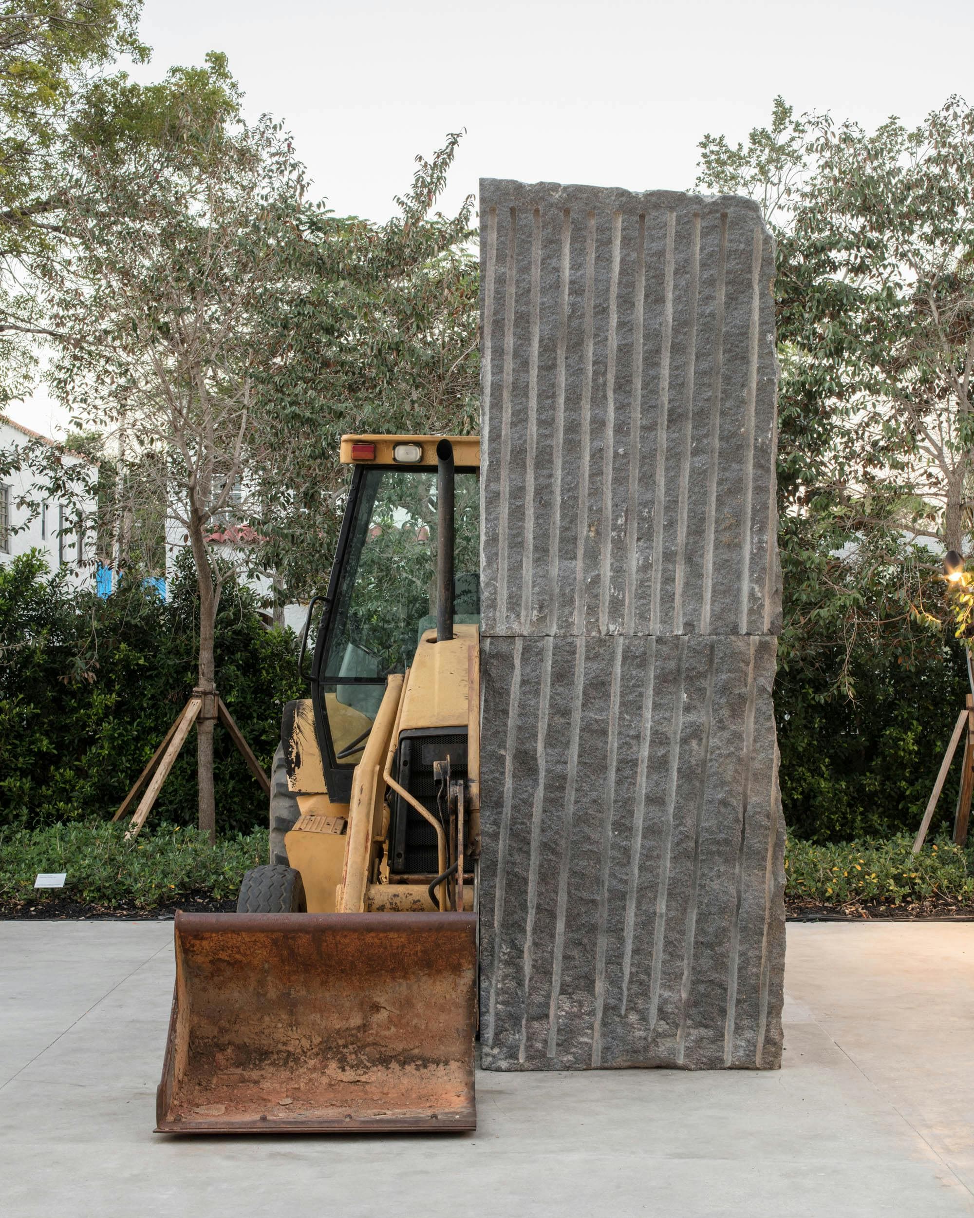 Allora & Calzadilla, Unspecified Promise, 2017, American black granite, 1993 Caterpillar 416 Series loader backhoe. Collection of Institute of Contemporary Art, Miami. Installed in the ICA Miami Sculpture Garden