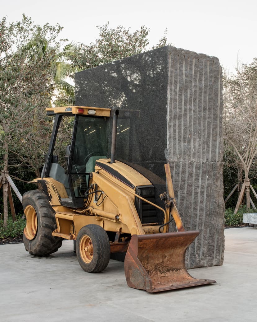 Allora & Calzadilla, Unspecified Promise, 2017, American black granite, 1993 Caterpillar 416 Series loader backhoe. Collection of Institute of Contemporary Art, Miami. Installed in the ICA Miami Sculpture Garden